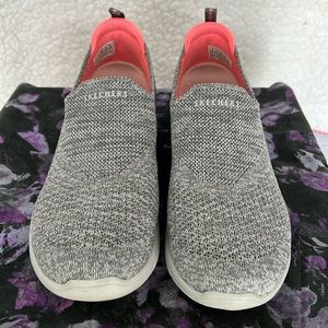 Women’s size 9 Skechers slip on gray shoe.